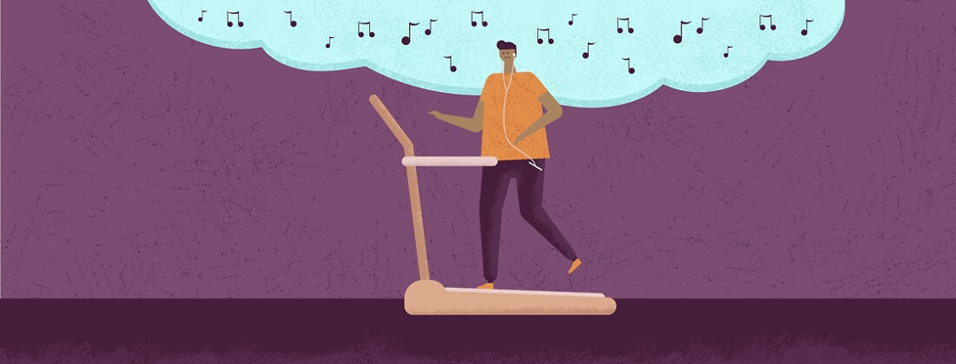 A man listening to music while running on a treadmill