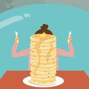 A woman about to eat a stack of pancakes