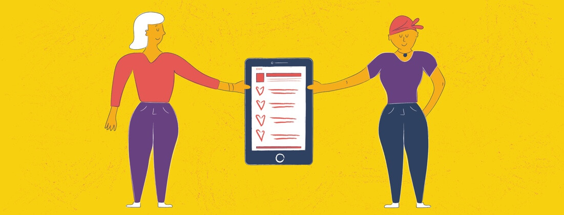 A mother and daughter holding either side of a phone
