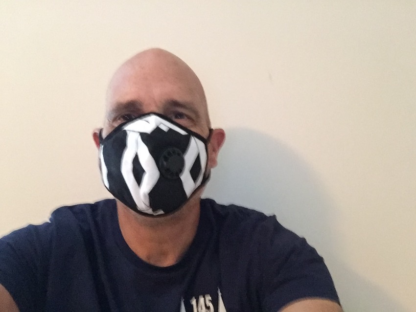 Mike wearing mask with black and white print