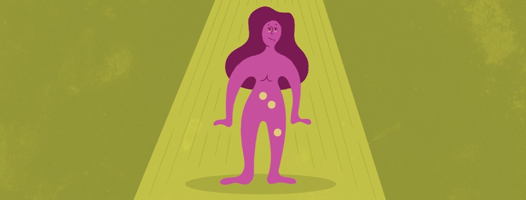 a woman standing in a spotlight with three areas of her body being highlighted with yellow circles