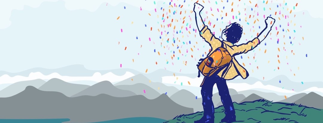 a man standing on a mountain looking victorious with confetti falling down on him