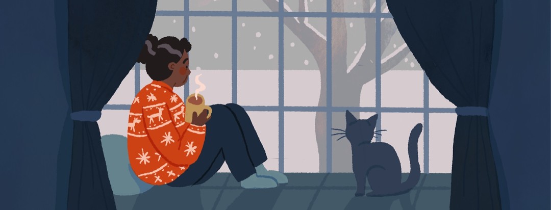 An older black woman sits at a snowy window wearing a bright red christmas sweater