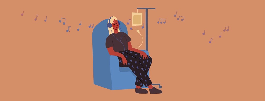 A woman receiving a chemo infusion while listening to music