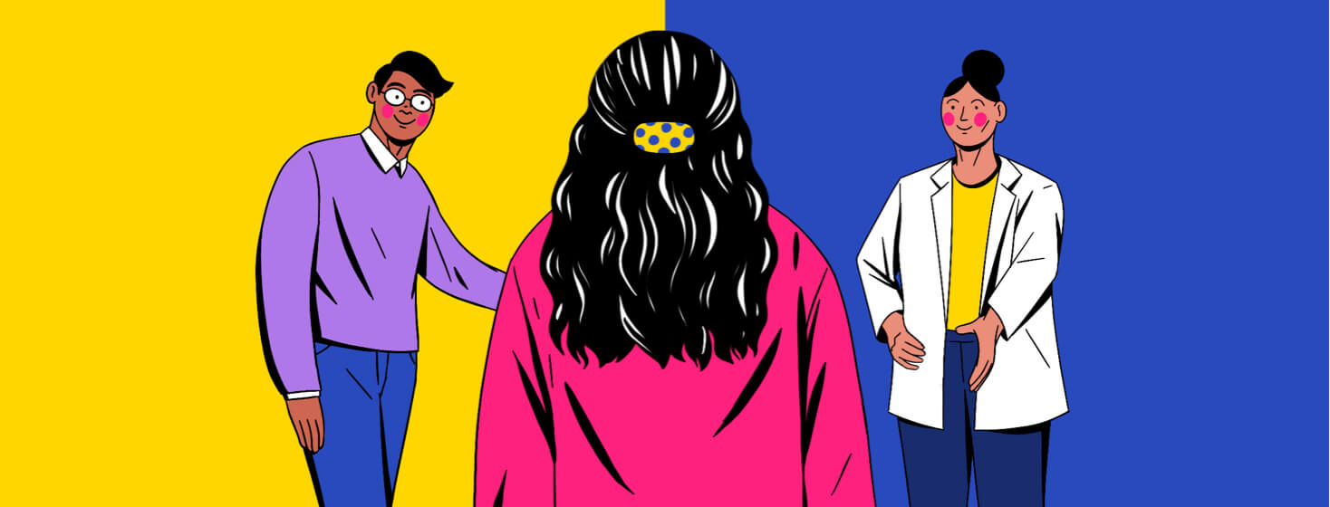 A woman stands between a man and a Female medical professional.