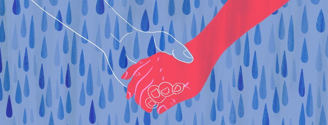 A hand holding the outline if a missing hand in the middle of a rain shower